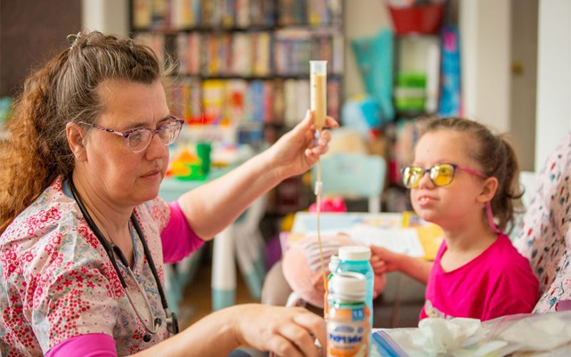 Caregiver assiting a child